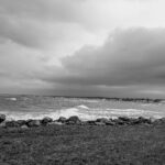 black and white, stormy seas with grey storm clouds