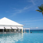 artwork of an infinity pool with a white cabana in bermuda